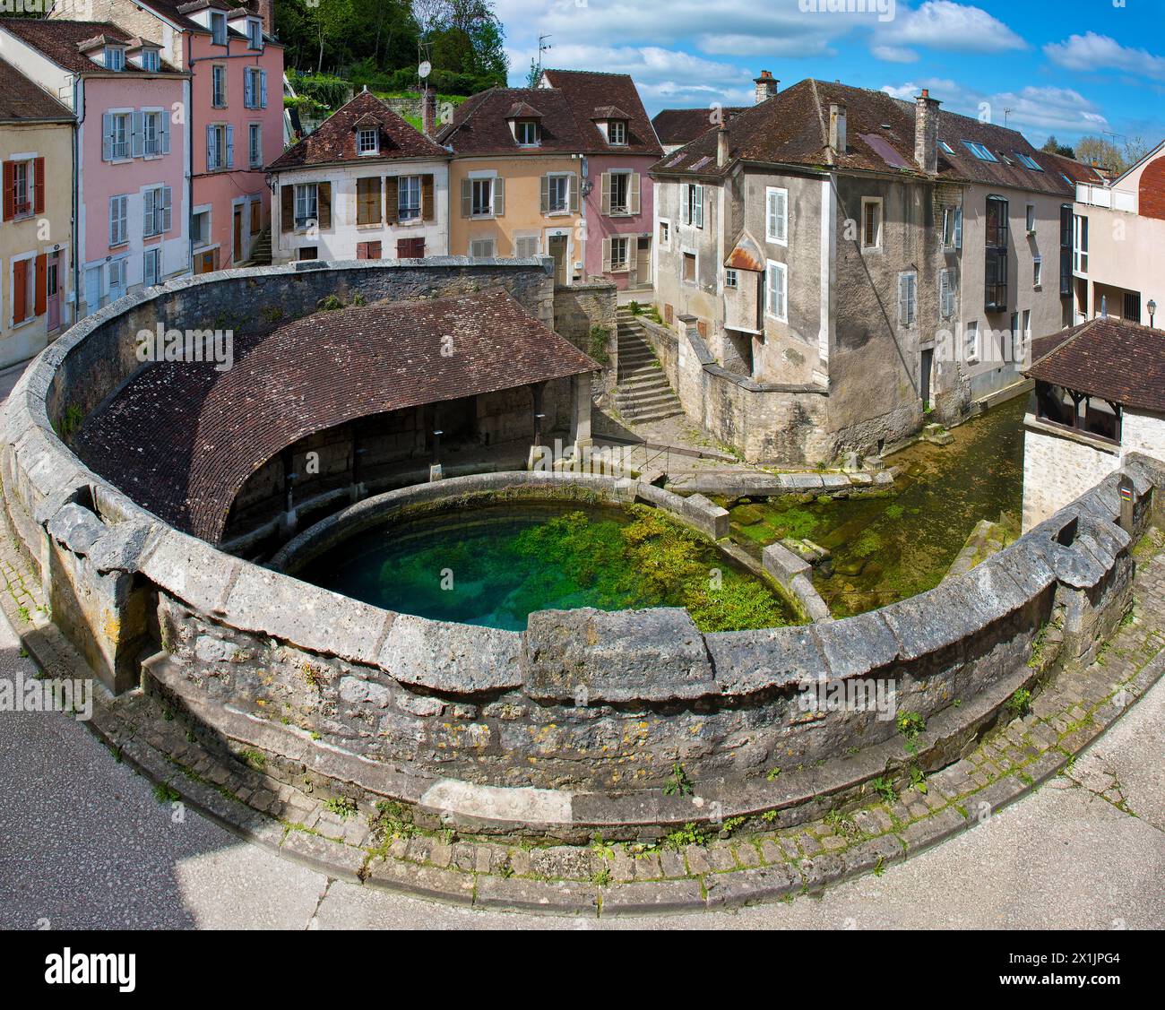 Fosse Dionne in Tonnerre, washing area at a karst spring with turquoise-blue water Stock Photo
