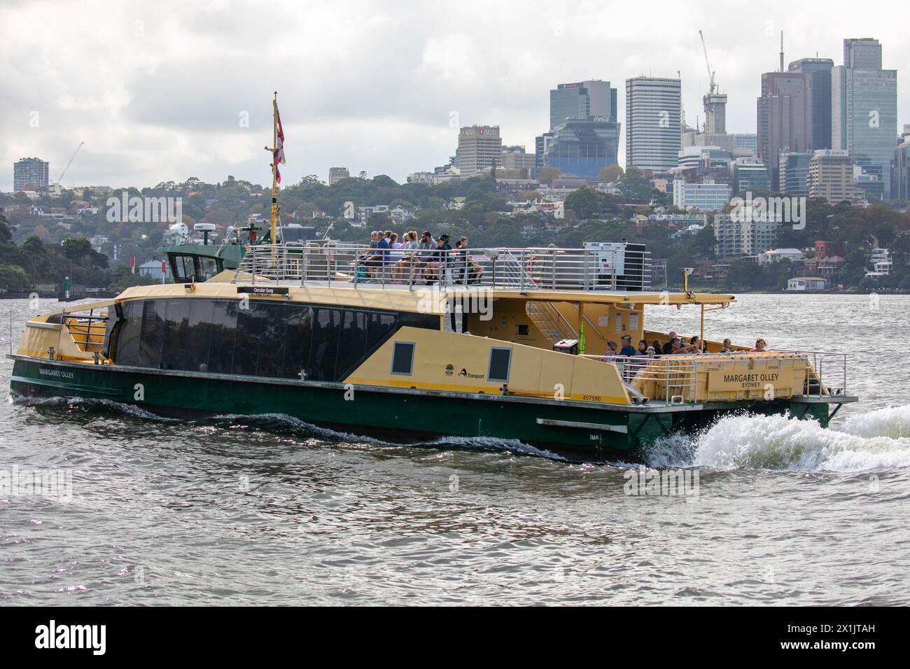 Sydney ferry, the MV Margaret Olley with passengers on the top deck, heads to Balmain East ferry wharf,Sydney harbour,NSW,Australia Stock Photo