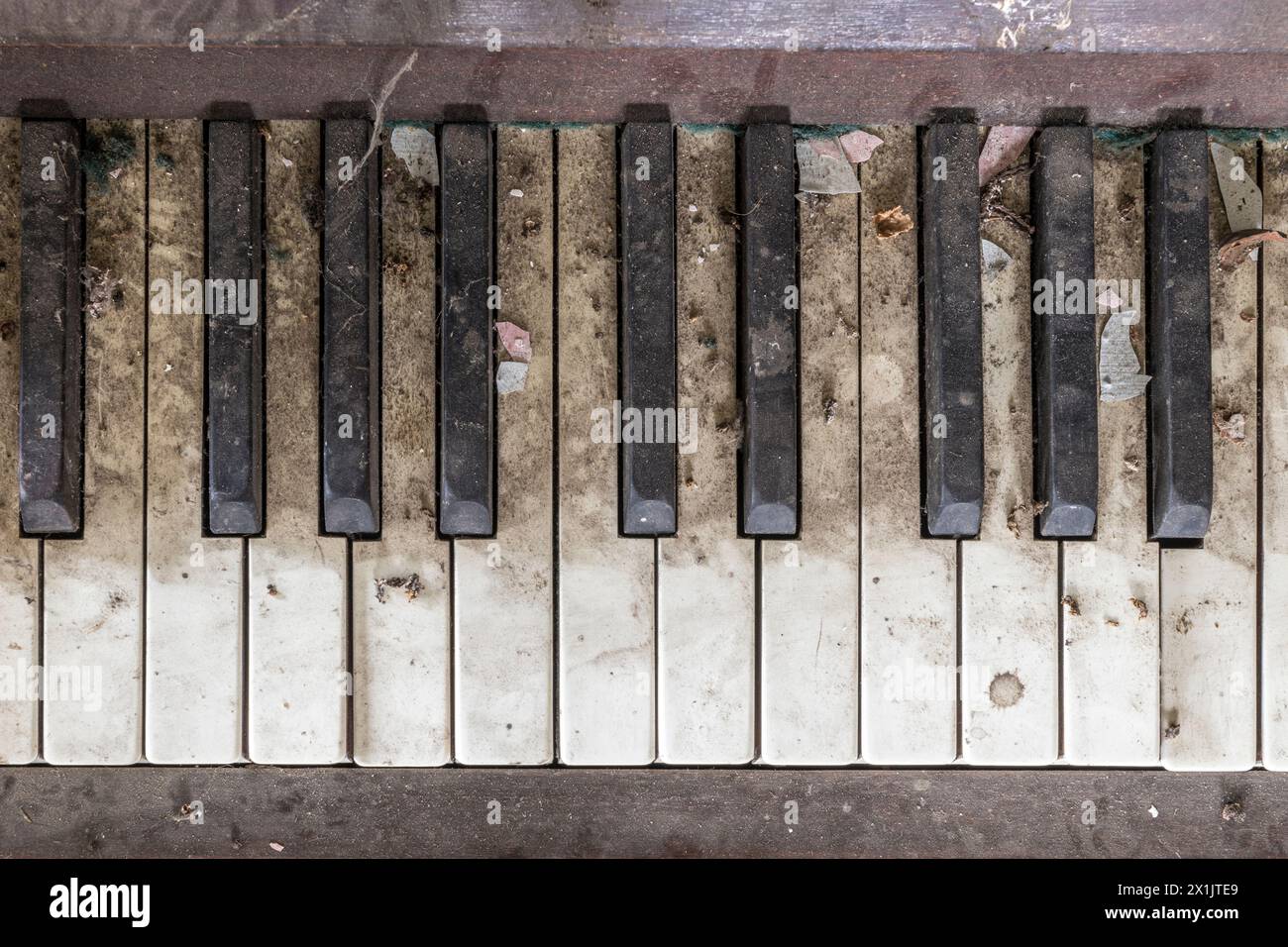An old abandoned Athelstan upright piano found in a derelict building, London, UK Stock Photo