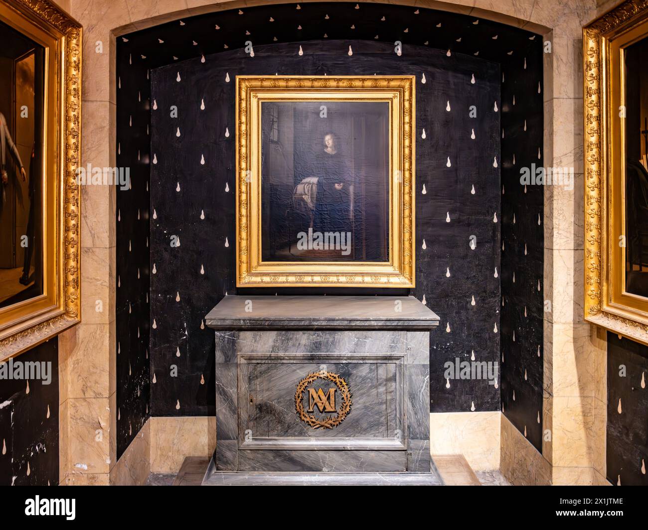 Marie-Antoinette Chapel in the Conciergerie, with her monogram and a portrait framed in gold. Paris, France Stock Photo