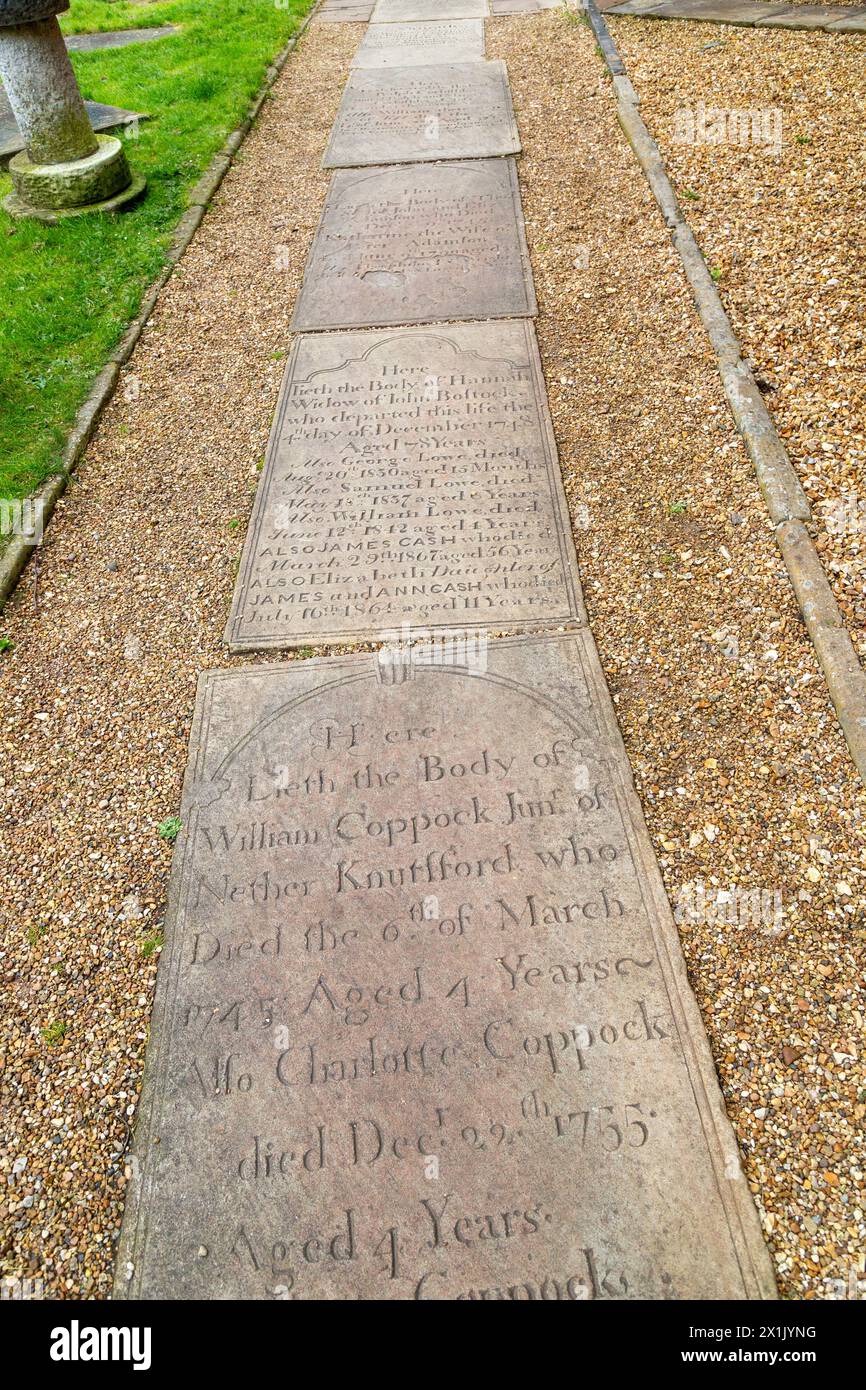 Old headstones used as paving at St John the Baptist, Church hill, Knutsford, Cheshire Stock Photo