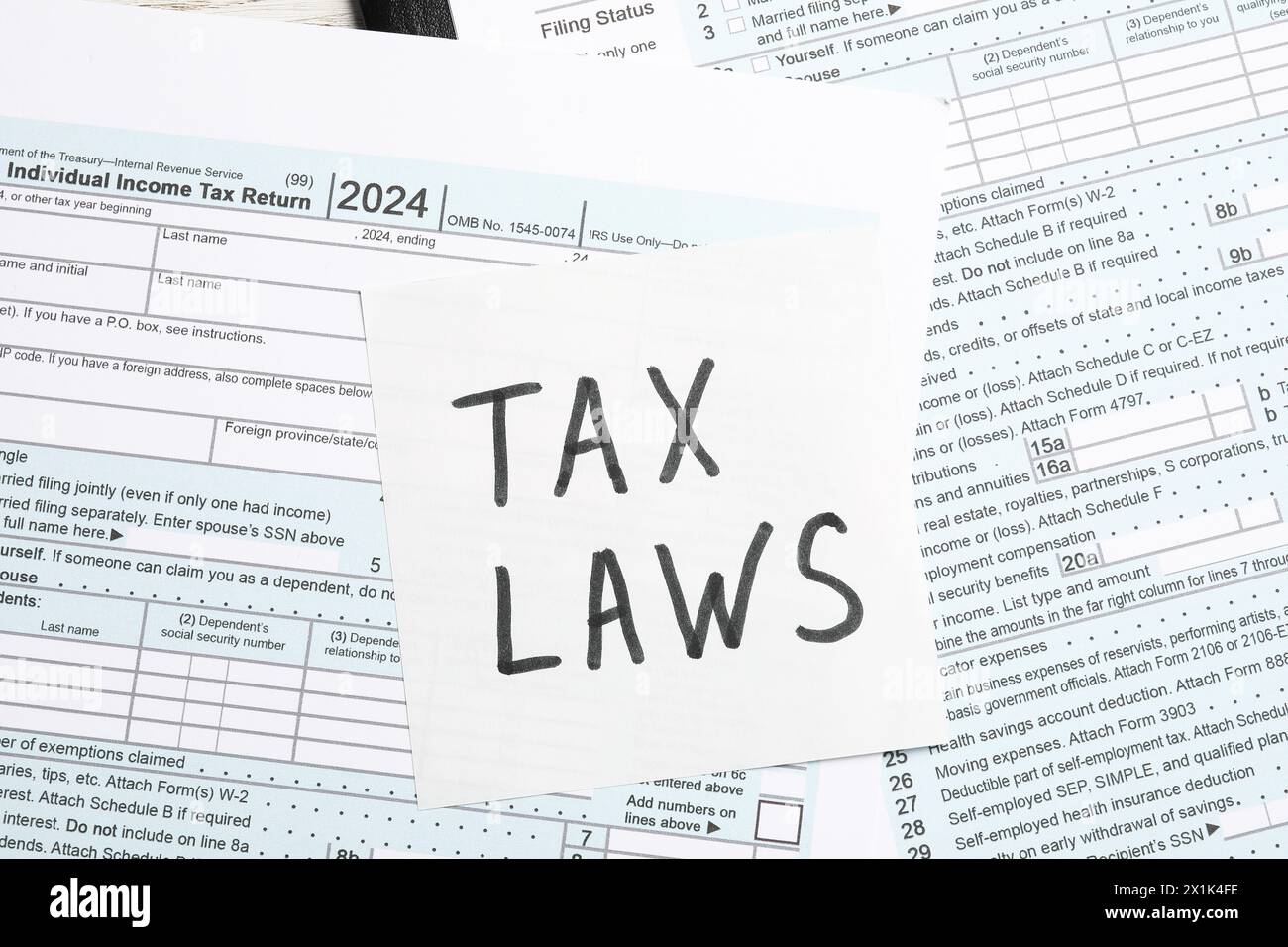 Paper note with words Tax Laws and forms on table, top view Stock Photo
