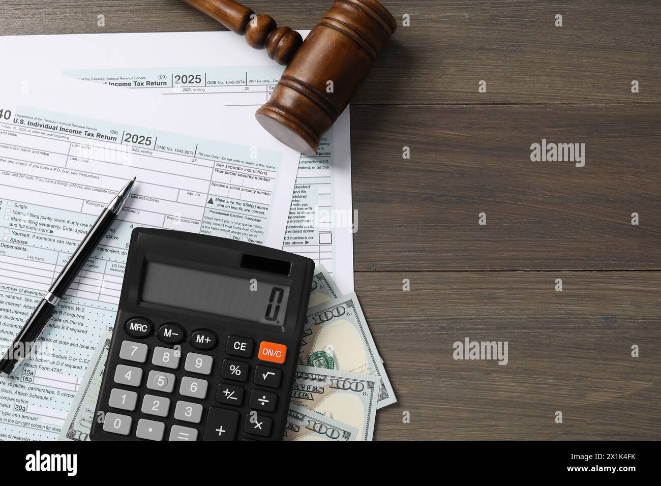 Tax law. Flat lay composition with gavel and forms on wooden table, space for text Stock Photo