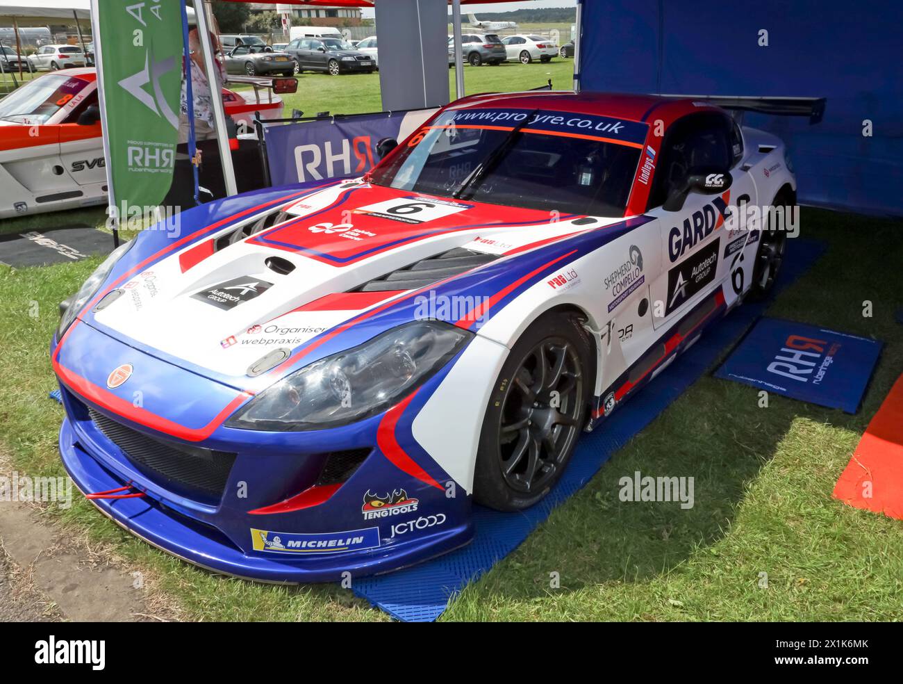 Three-quarters front view of a Ginetta G55,  designed to compete in the Ginetta GT Supercup race series, on display at the 2023 British Motor Show Stock Photo