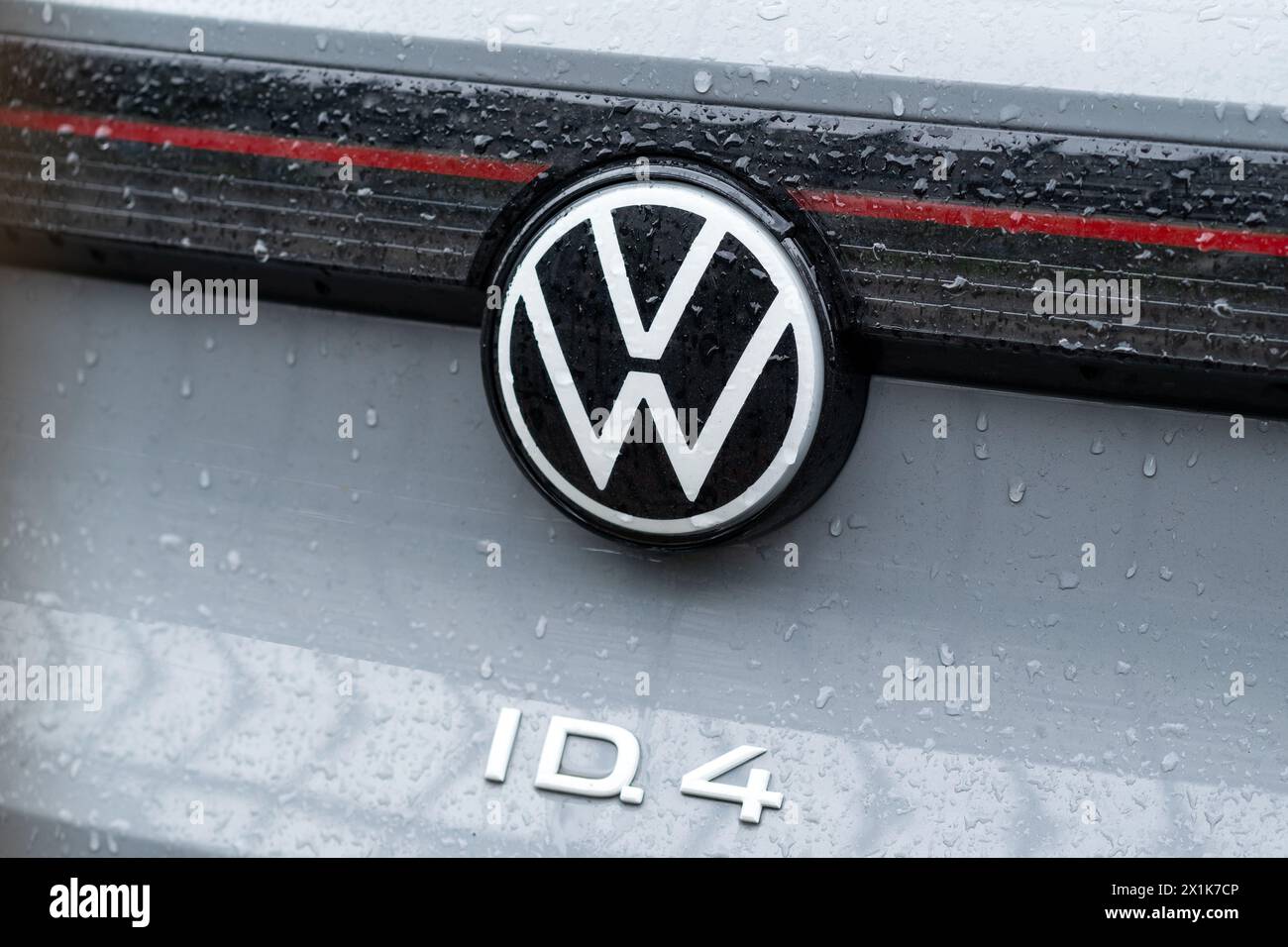Kyiv, Ukraine. April, 2024. Back View gray Volkswagen ID.4 all-electric SUV-coupe car close up logo. LED rear lights and car design. Stock Photo