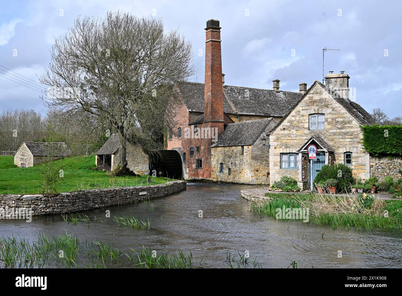 The Old Mill on the River Eye in Lower Slaughter in the Cotswolds Gloucestershire Stock Photo