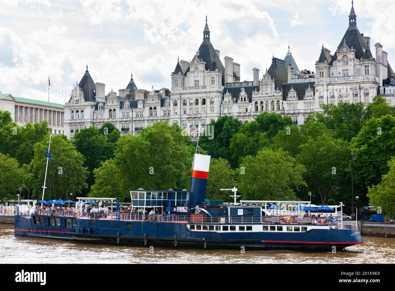London, United Kingdom - June 29, 2010 : Tattershall Castle . Floating pub on River Thames in front of The United Nations UK building. Stock Photo