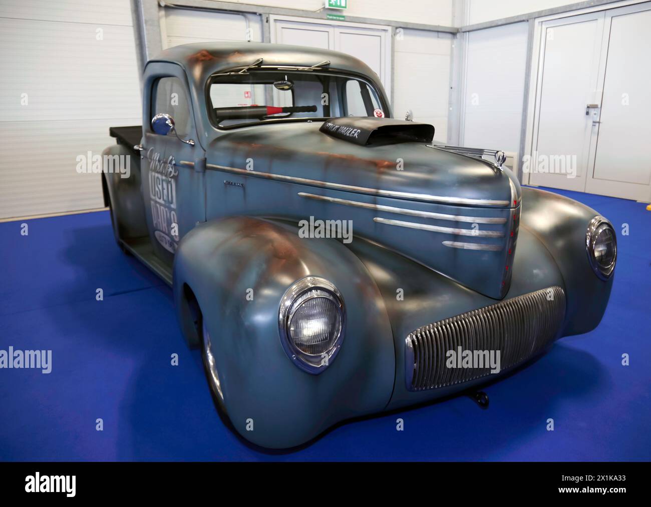 Three-quarters front view of an American,  Customized, Rat Rod, Classic Pickup Van, on display at the 2023 British Motor Show Stock Photo