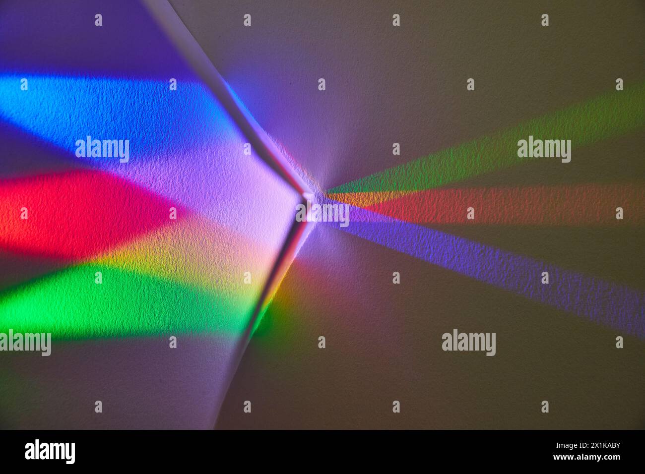 Color Spectrum Light Play on Room Corner Stock Photo