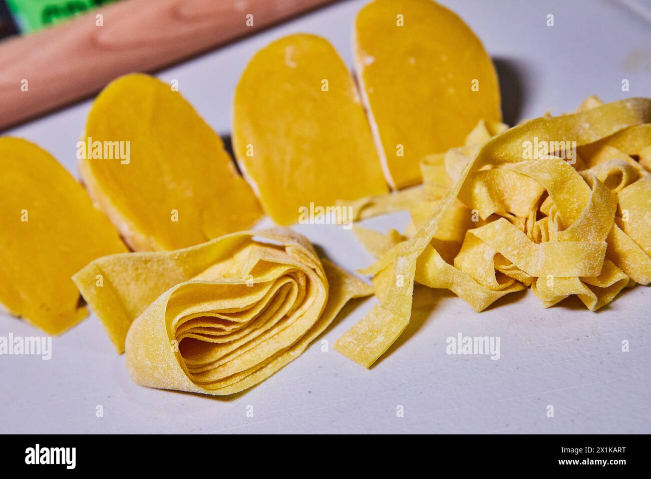 Handmade Pasta Variety with Dough Wedges in Domestic Kitchen Stock Photo