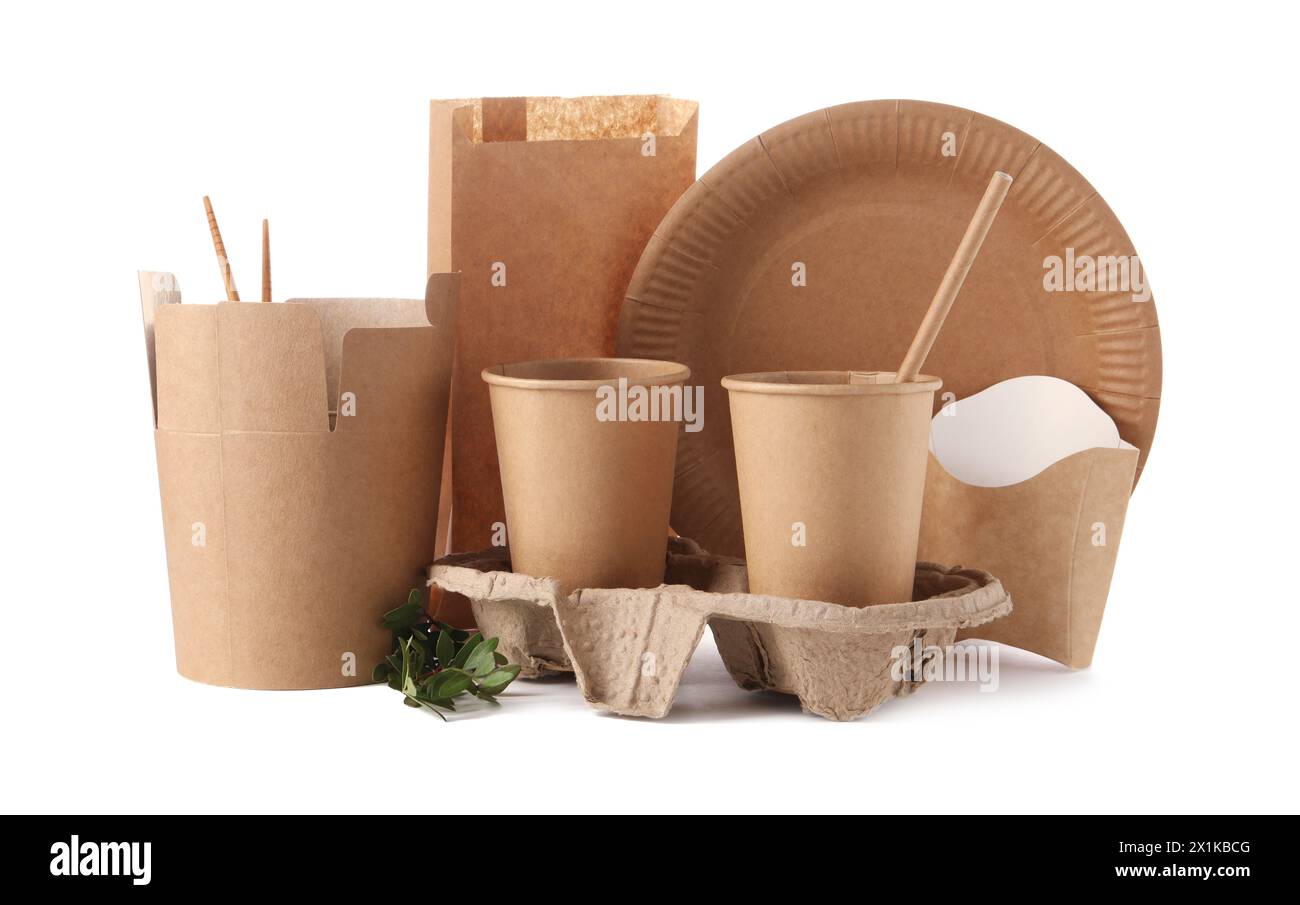 Eco friendly food packagings, tableware, paper bag and twig isolated on white Stock Photo