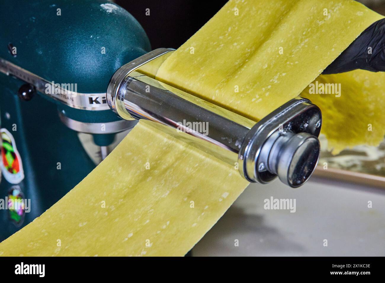 Handmade Pasta Making with Machine in Kitchen Stock Photo