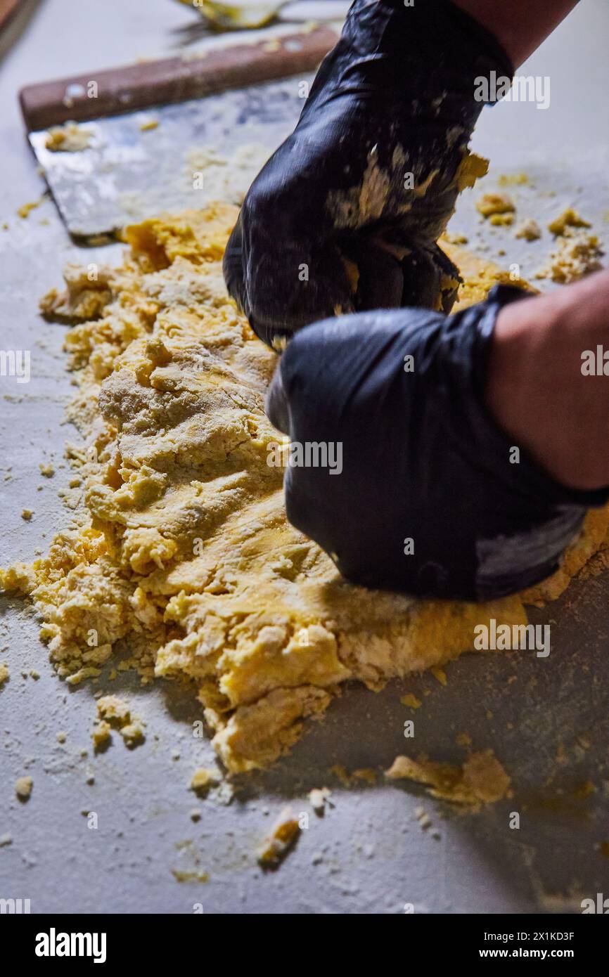 Baker Kneading Pasta Dough, Black Gloves, Kitchen Action Shot Stock