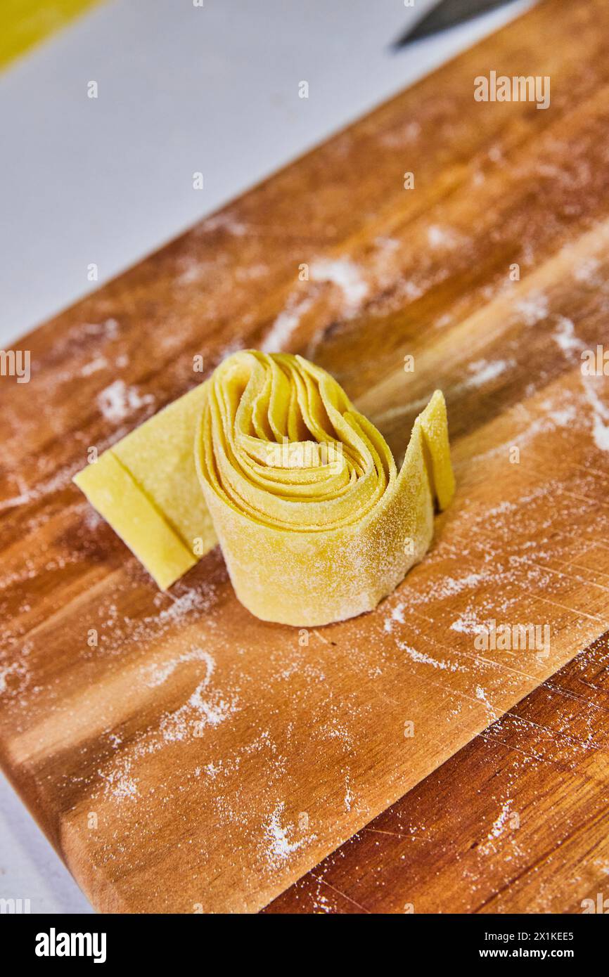 Handmade Pappardelle Egg Pasta on Rustic Wooden Board Stock Photo