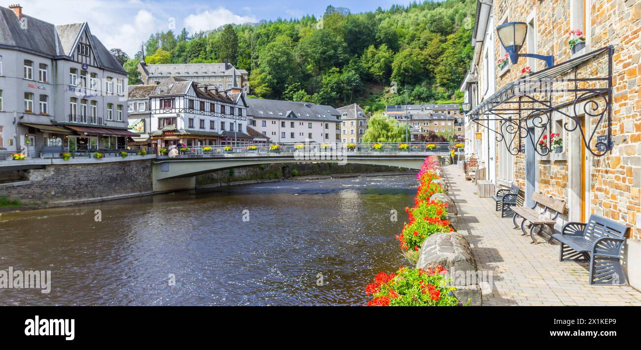 Panorama of red flowers at the river promenade in La Roche-en-Ardenne, Belgium Stock Photo