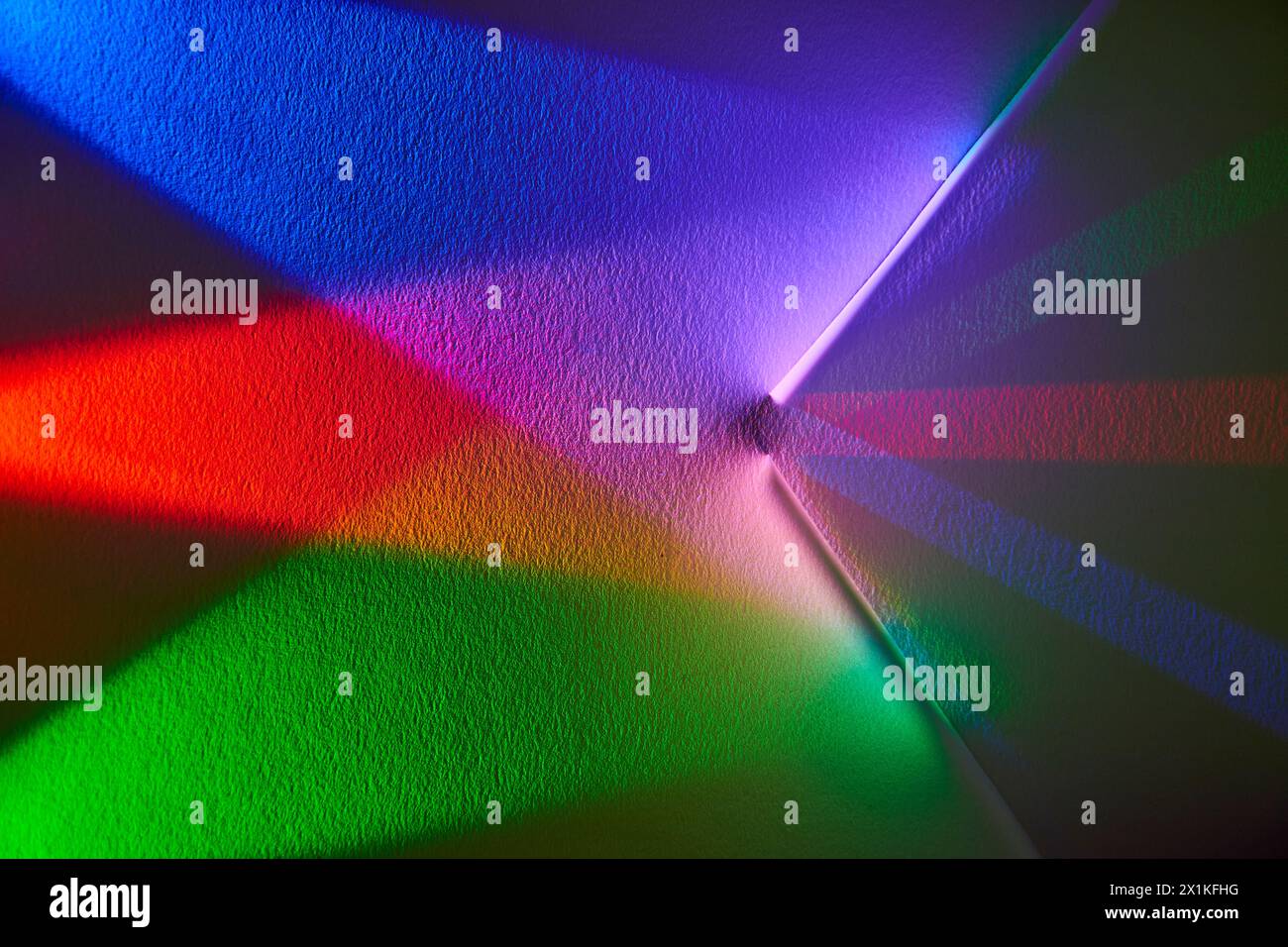 Vibrant Spectrum Light Burst on Textured Surface Stock Photo