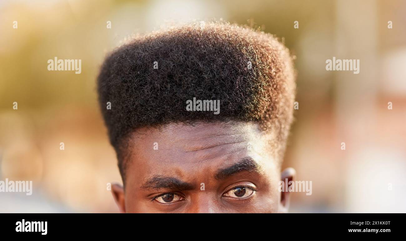 Black man, portrait and eyes for haircut in outdoors, afro and curly hairstyle in city. Male person, high top fade and fresh cut for aesthetic Stock Photo