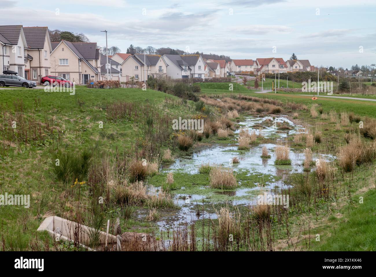 Sustainable urban drainage scheme, Suds to prevent flash flooding overwhelming sewage disposal system.  Cala Homes Cults Aberdeen Stock Photo