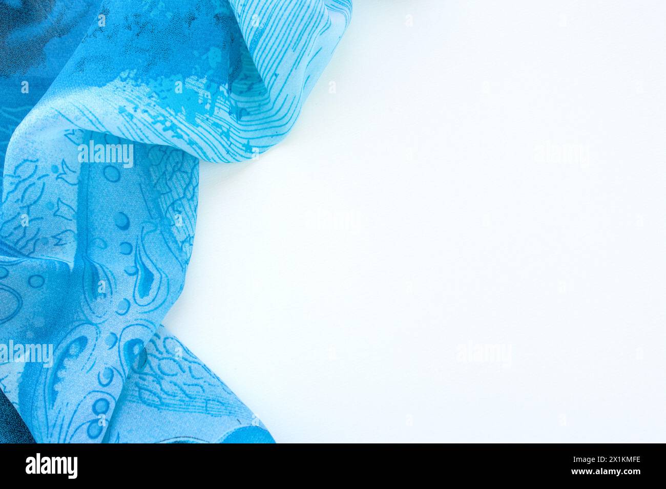 Blue fabric on white background with space for copy. Horizontal texture abstract background. Stock Photo