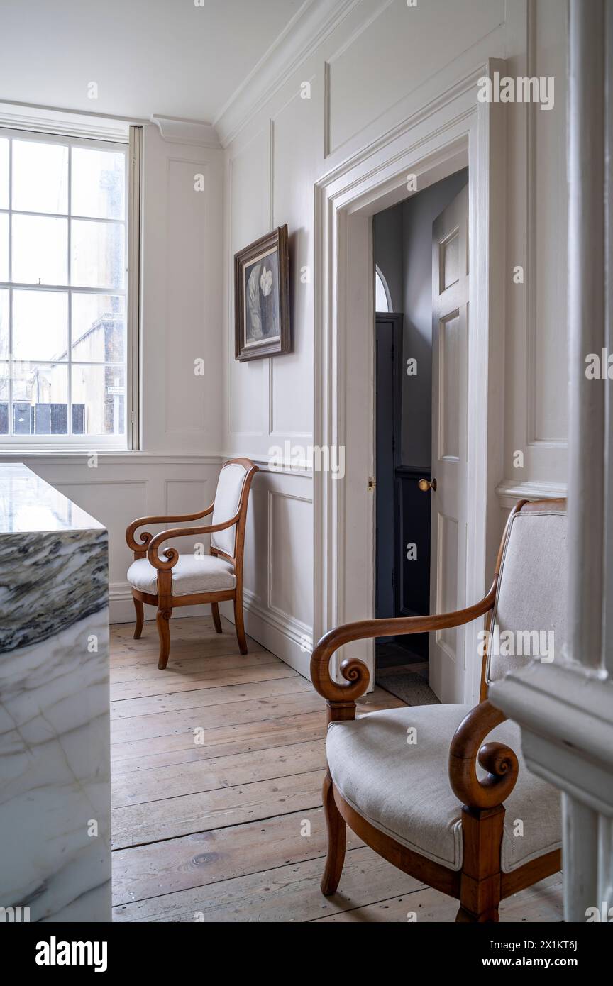 Pair of vintage wooden armchairs in stylish Georgian townhouse, Greenwich, London, UK Stock Photo
