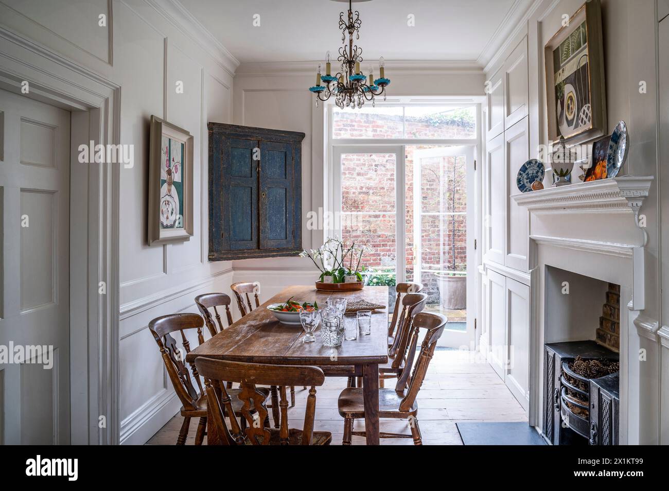 Vinate table and chairs with patio doors to outside space in Georgian townhouse, Greenwich, London, UK Stock Photo
