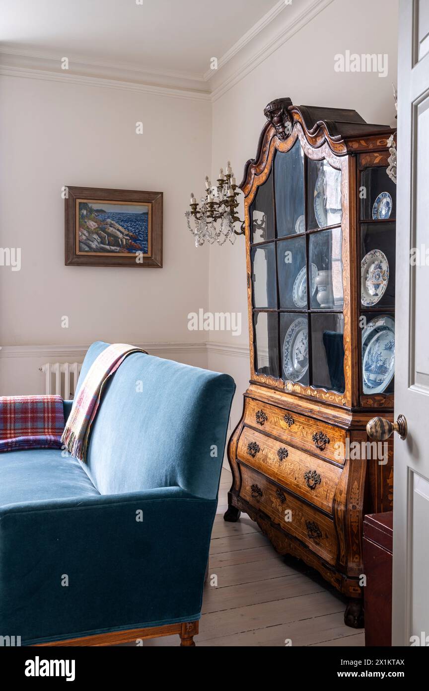 Antique display cabinet in living room of stylish Georgian townhouse, Greenwich, London, UK Stock Photo