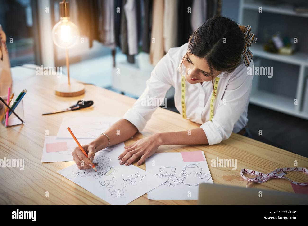 Female tailor drawing sketches hi-res stock photography and images - Alamy
