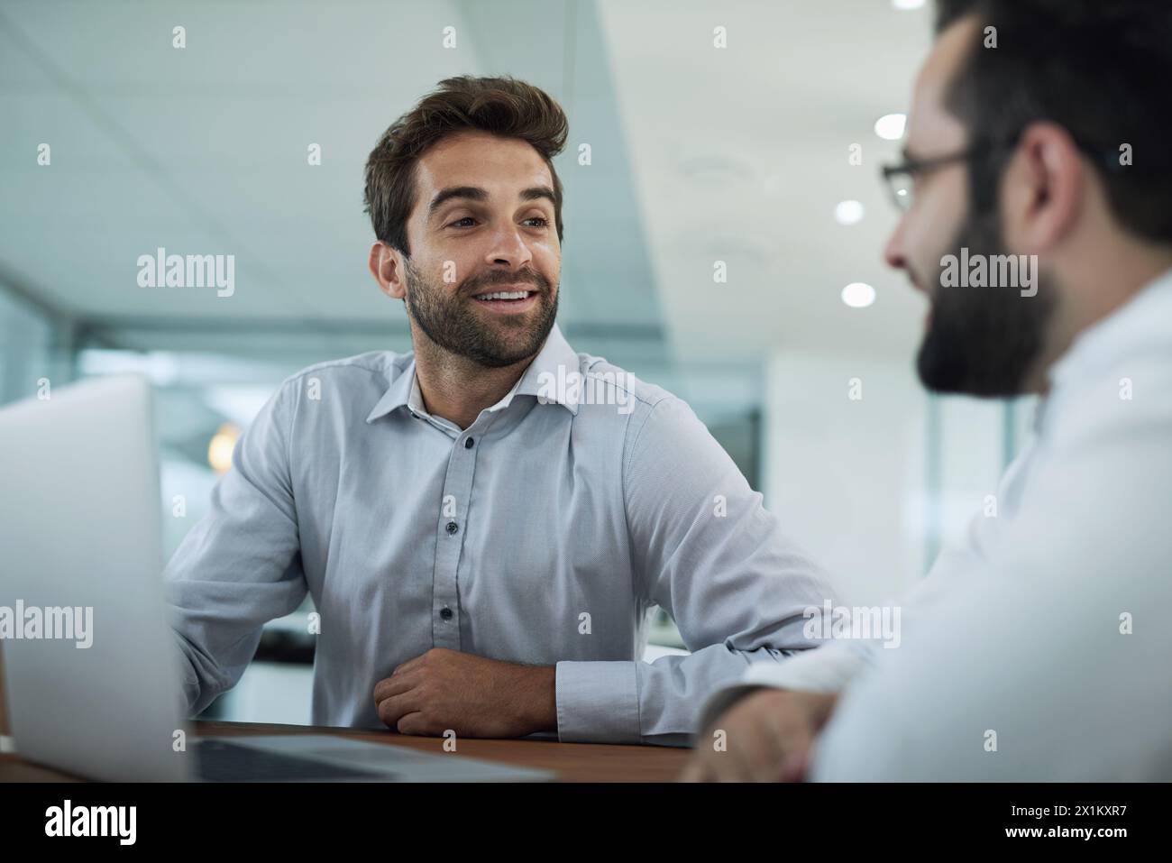 Teamwork, designer and men on laptop for software, research or web design programming. Technology, problem solving or programmers in office for Stock Photo