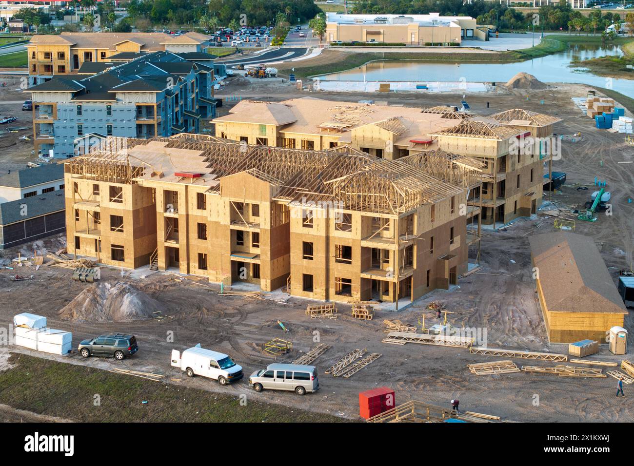 Aerial view of unfinished wooden frames of apartment buildings under ...