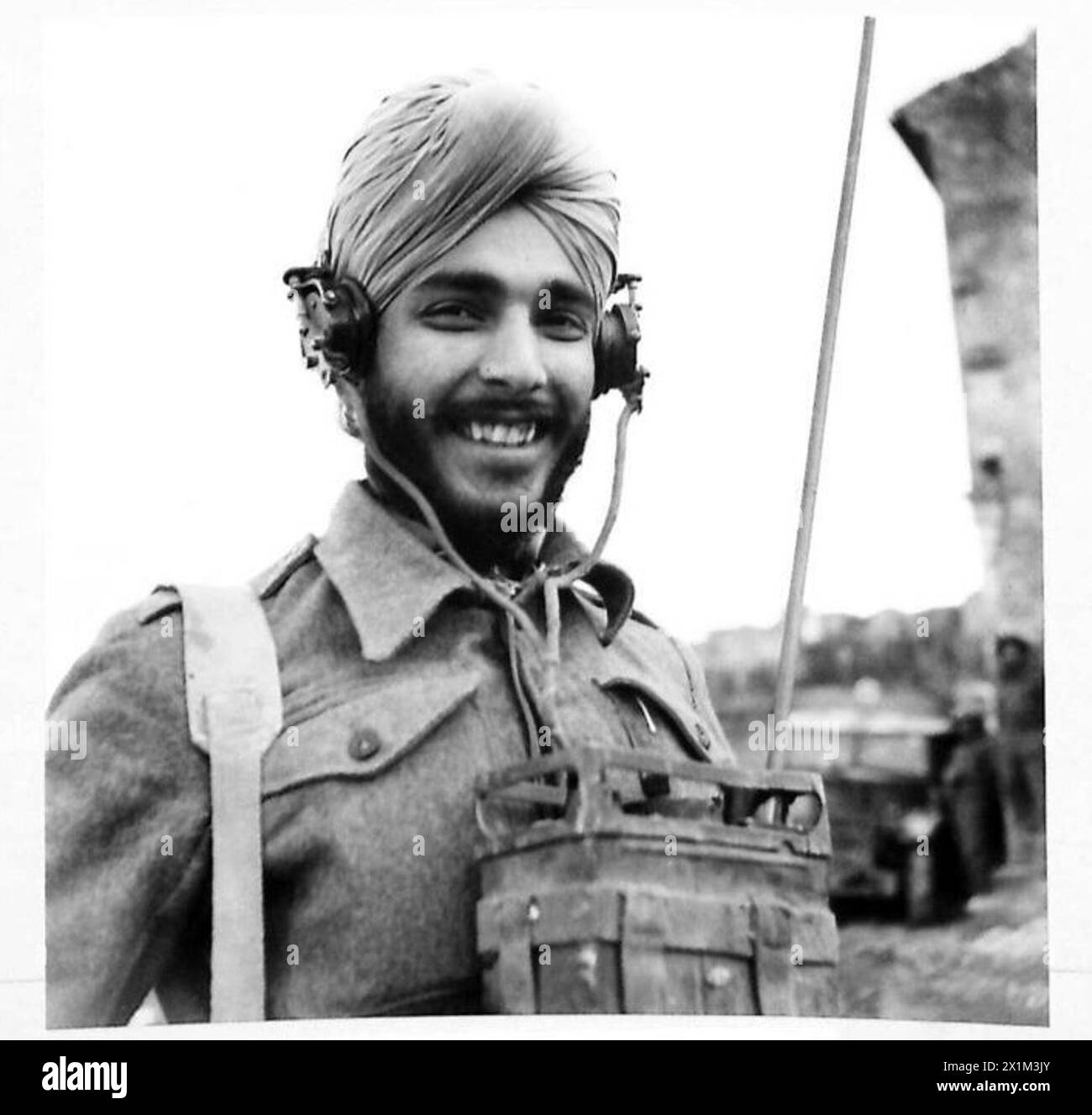 Indian troops, including Rifleman Arjan Singh as a wireless operator, serve with the British Eighth Army in Italy during wartime operations. Stock Photo