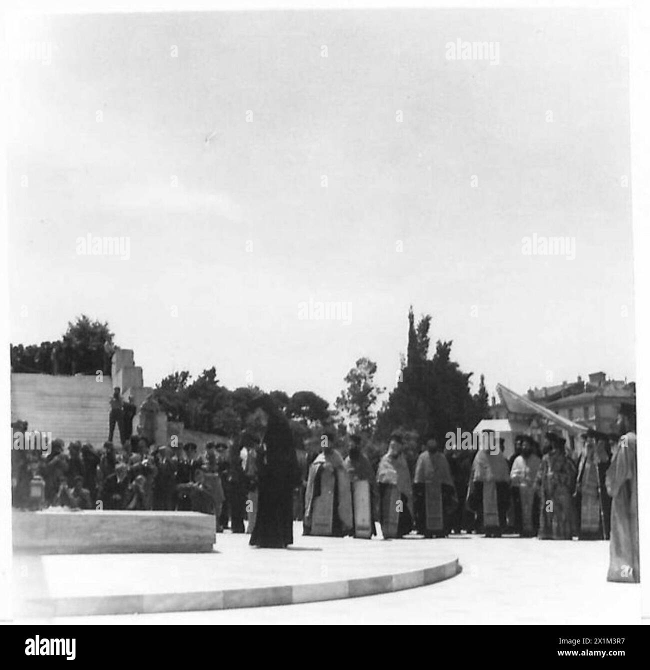 ATHENS CELEBRATES GERMAN CAPITULATION - Archbishop Damskinos lays a wreath on the Tomb of the Unknown Warrior, British Army Stock Photo