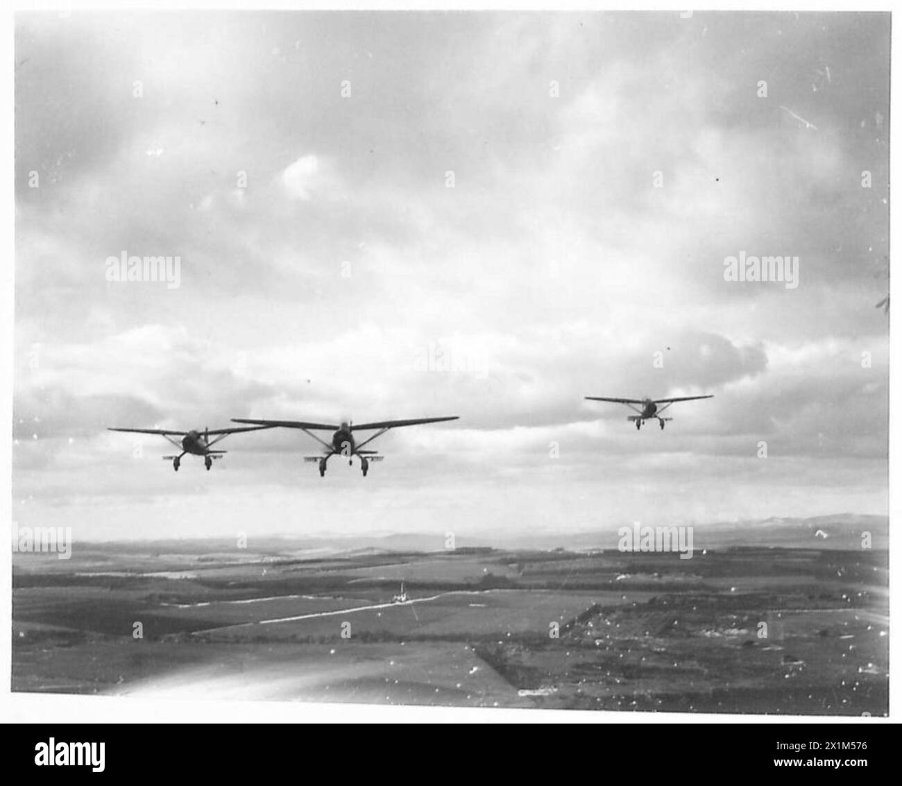 THE POLISH AIR FORCE IN BRITAIN, 1940-1947 - Three Westland Lysander Mark IIIAs of No. 309 Polish Fighter-Reconnaissance Squadron (part of the RAF Army Cooperation Command), based at Dunino, Fife, on a photo reconnaissance training sortie over Scottish landscape, Polish Air Force, Polish Air Force, 309 'Land of Czerwień' Fighter-Reconnaissance Squadron, Royal Air Force, Station, Calveley Stock Photo