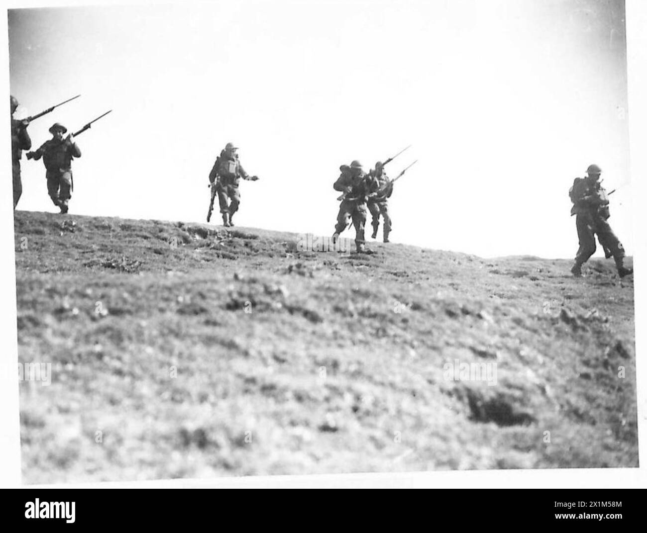 ROUNDING UP ENEMY PARACHUTISTS - A bayonet charge, British Army, 5th Battalion, Border Regiment, British Army, 125th Infantry Brigade, British Army, 42nd Division Stock Photo