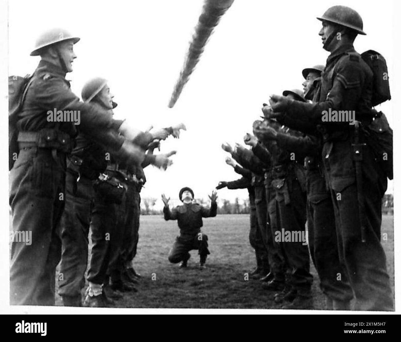 TOUGHENING UP - Finally the men are given exercises with heavy logs to ...