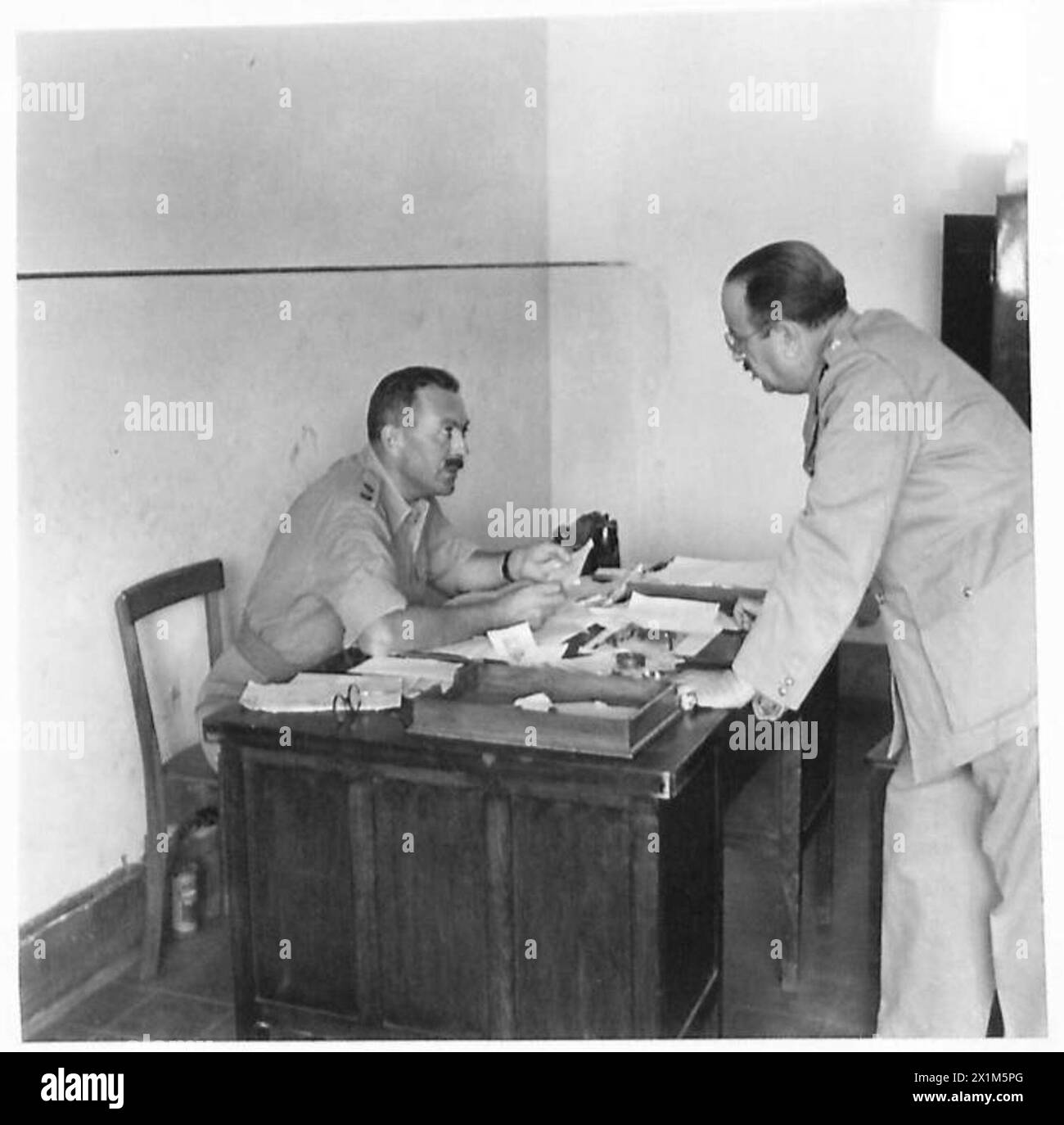 Captain AI Benachi discusses operational matters with Major Buckley at ...