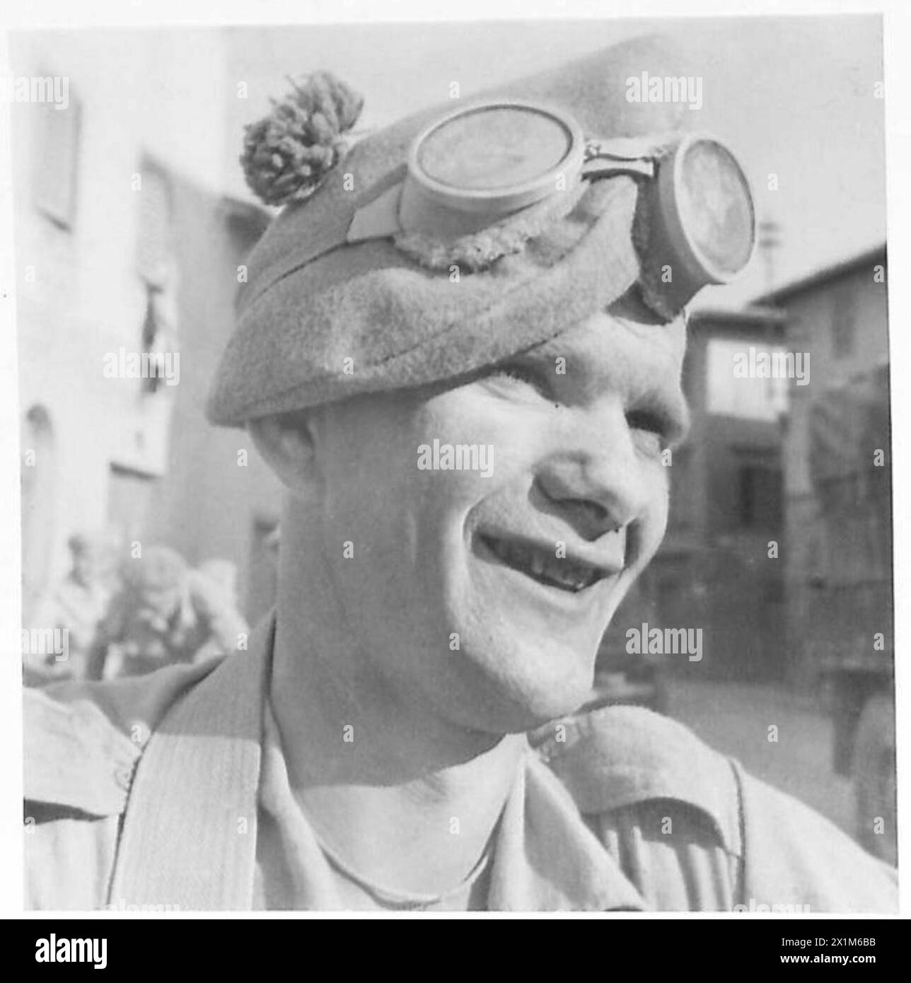 EIGHTH ARMY FACES ON "ARROW ROUTE" L/Cpl. T. Gracie (Gordon Highlanders) of 19 Lanark Road