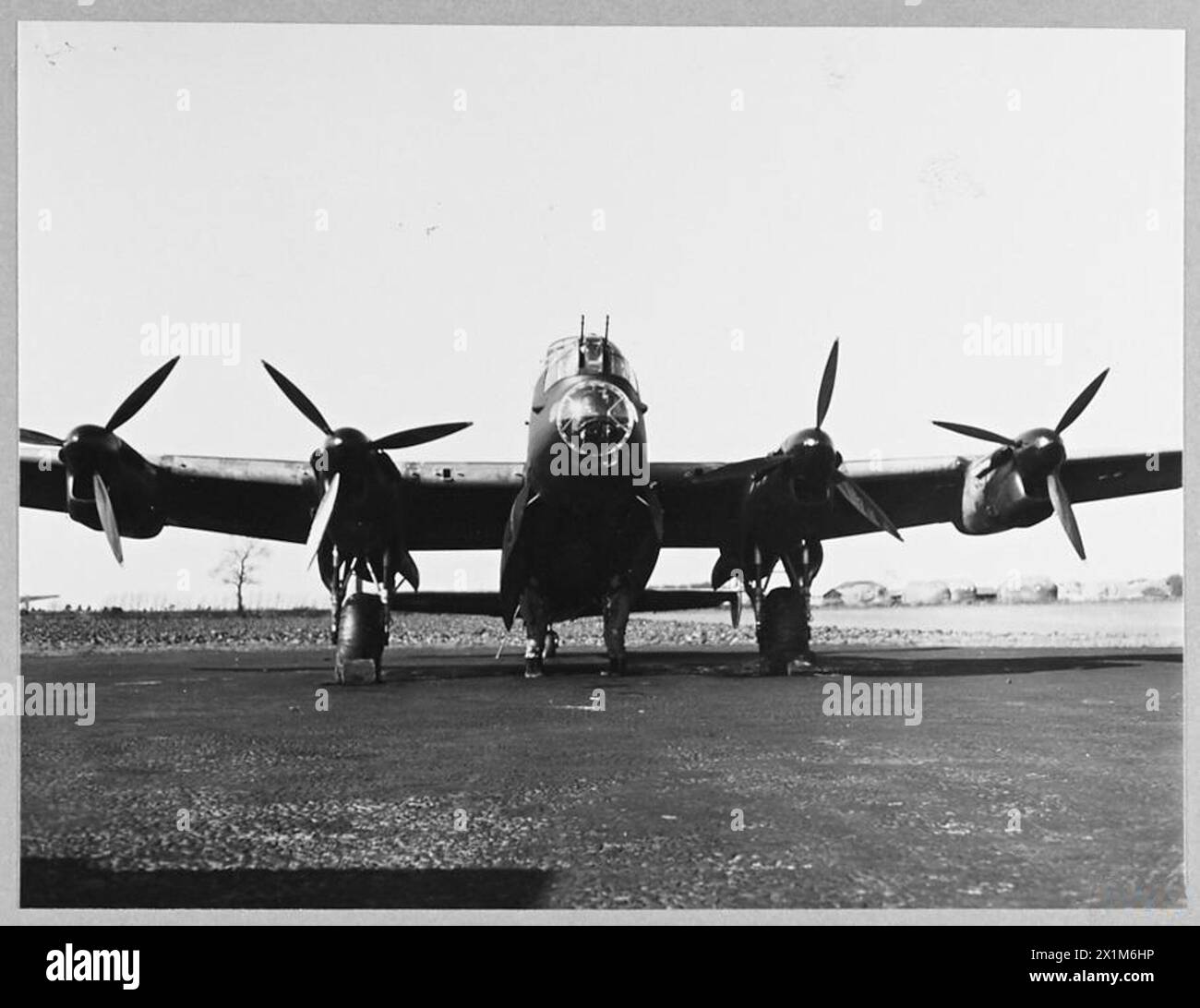 MEN OF SWINDON'S LANCASTER SQUADRON OFF ON AN OFFENSIVE - 8963 The bomb aimer and the navigator checking the bomb load, Royal Air Force Stock Photo