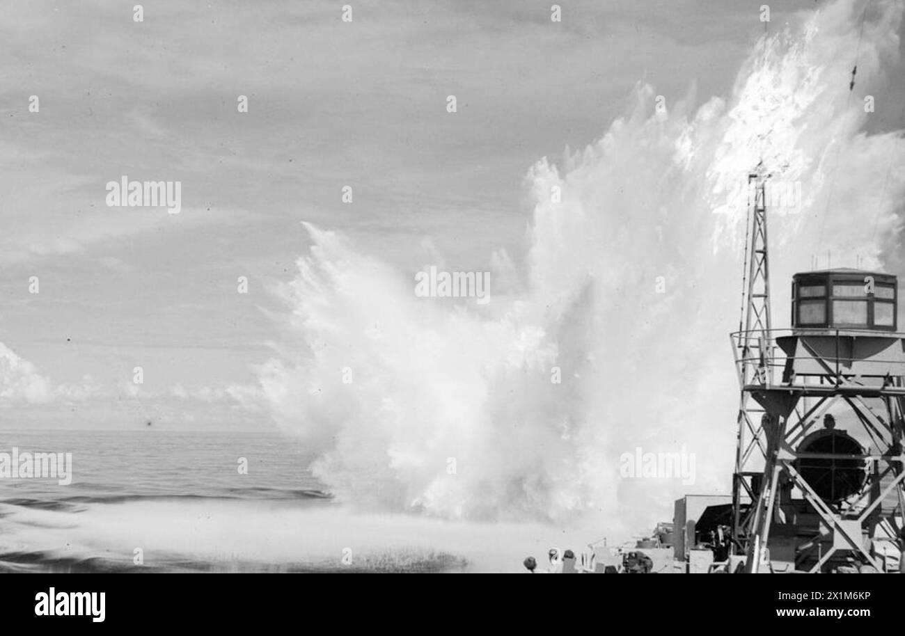 EASTERN FLEET ATTACK THE NICOBAR ISLANDS. OCTOBER 1944, ON BOARD HMS RAIDER, IN THE INDIAN OCEAN DURING THE BOMBARDMENT OF THE NICOBAR ISLANDS SOUTH OF THE ANDAMANS, BY UNITS OF THE EASTERN FLEET. - HMS RAIDER drops a depth charge when a U-boat was located in the bombardment area, Stock Photo