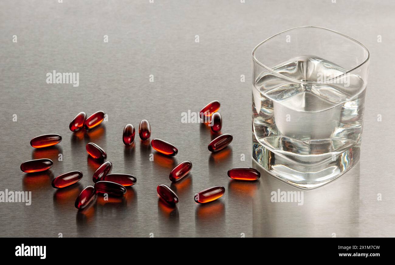 glass of water with pills Stock Photo