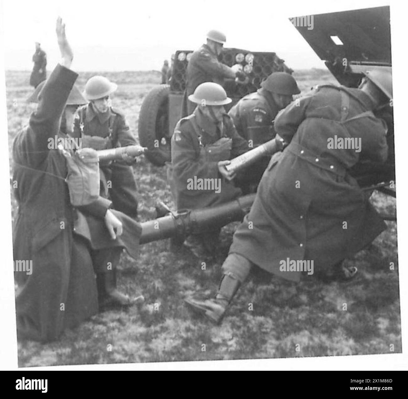 Open Rations British Army Home Guard personnel operate an 18-pounder field gun during artillery ...