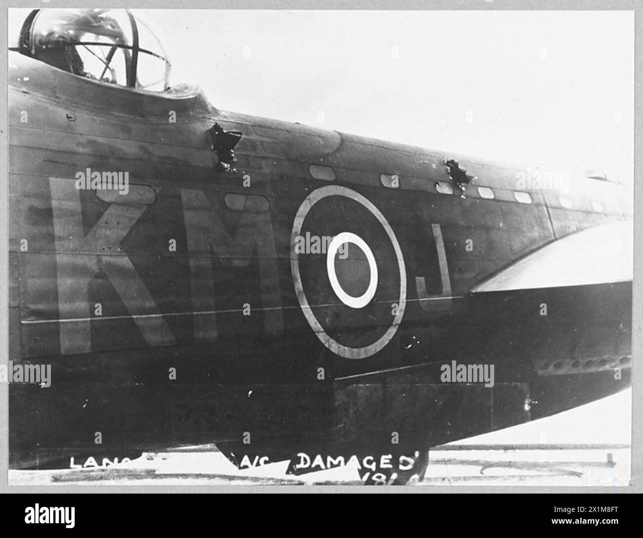 DAMAGED LANCASTER BOMBS TARGET AND RETURNS SAFELY FROM PEENEMUNDE. - 10914. Damage to the fuseluge, Royal Air Force Stock Photo
