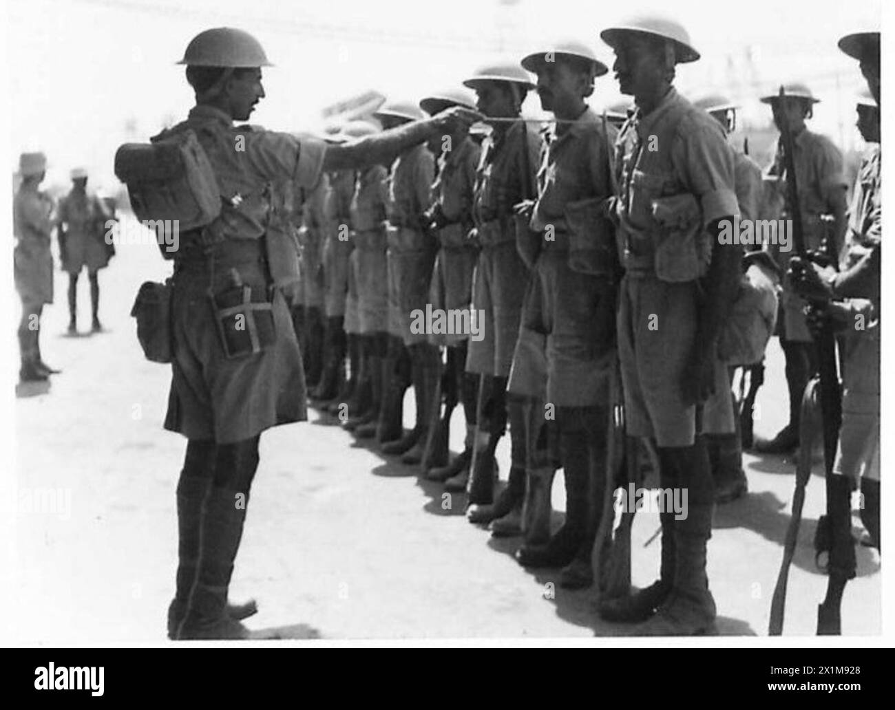 PICTURES FROM IRAN (PERSIA) - Indian troops lined up outside the H.Q. of the Anglo-Iranian Oil Co. on Aradian Island, British Army Stock Photo