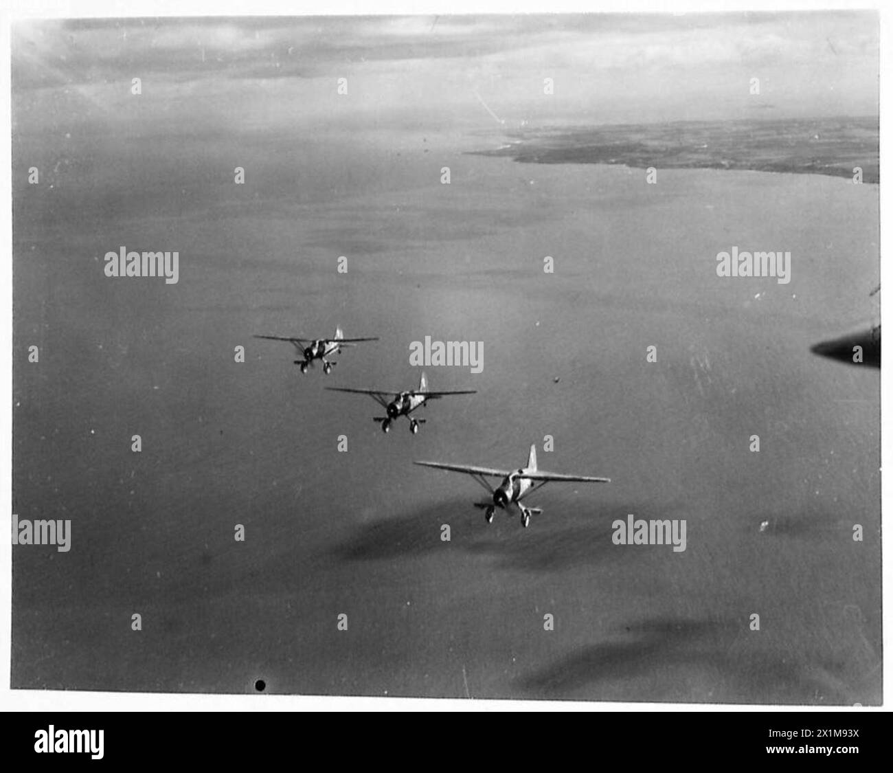 THE POLISH AIR FORCE IN BRITAIN, 1940-1947 - Three Westland Lysander Mark IIIAs of No. 309 Polish Fighter-Reconnaissance Squadron (part of the RAF Army Cooperation Command), based at Dunino, Fife, on a photo reconnaissance training sortie over Scottish coast, Polish Air Force, Polish Air Force, 309 'Land of Czerwień' Fighter-Reconnaissance Squadron, Royal Air Force, Station, Calveley Stock Photo