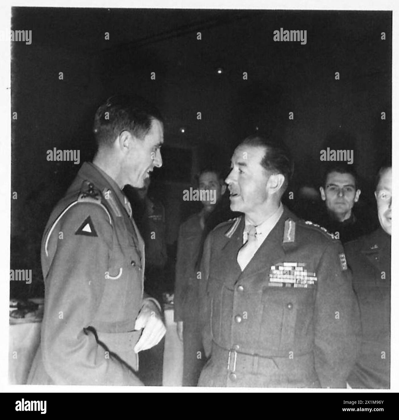 Field Marshal Alexander and General Pool are pictured conversing at a ...