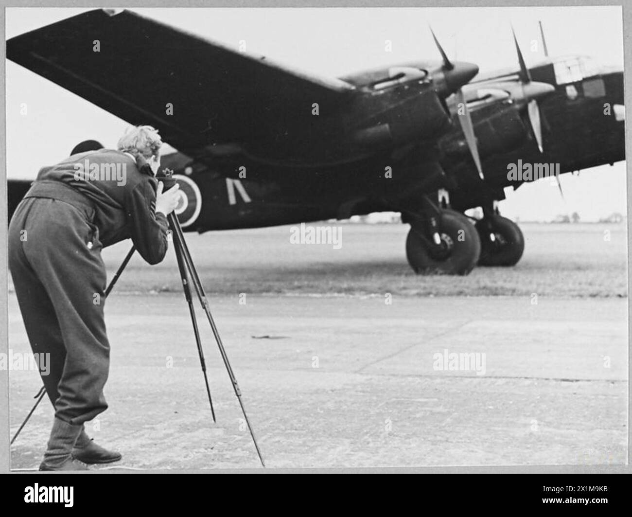 Raf Nav RAF navigator swings the compass aboard a Halifax bomber, ensuring ...