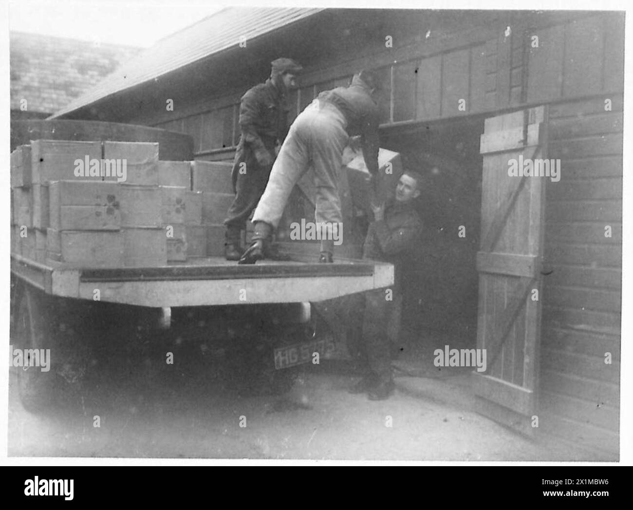 SARDINE TINS TO TANKS - Tin goods leaving NAAFI Stores, British Army Stock Photo