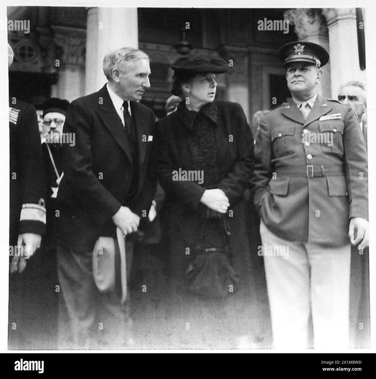 In Greece, Mr. MacVeagh, the American Ambassador, and his wife exit the ...