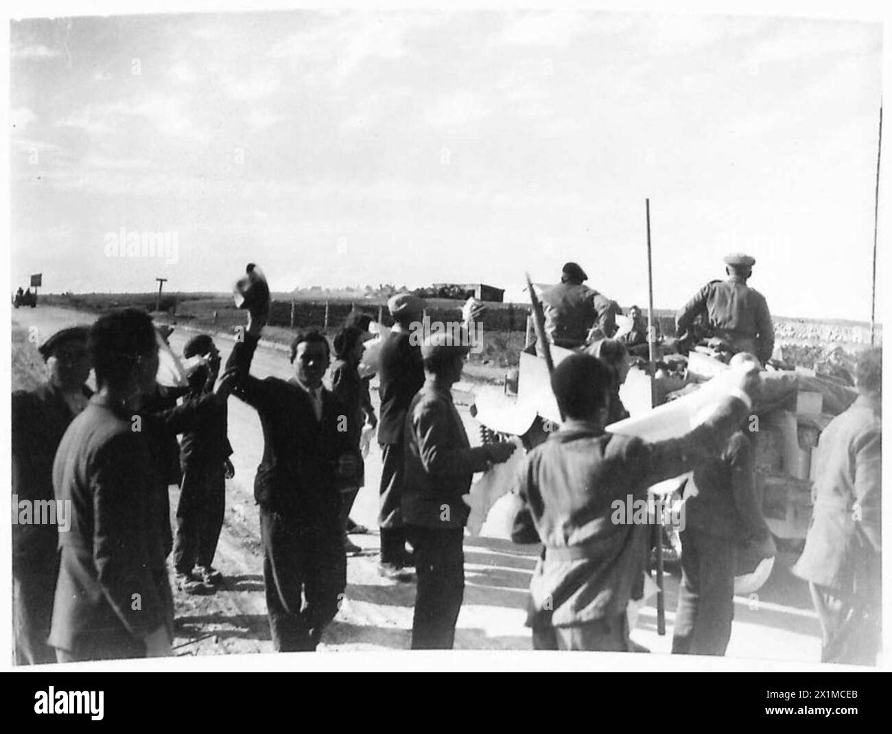 LATEST PICTURES FROM THE WESTERN DESERT AT GIOVANNI CIRENE AREA - Our troops, on entering Giovvani Berta, were to given a cordial reception by the local inhabitants who, on seeing the friendliness of the British, waved white flags to cheer them on instead of using them for a signal of surrender, British Army Stock Photo