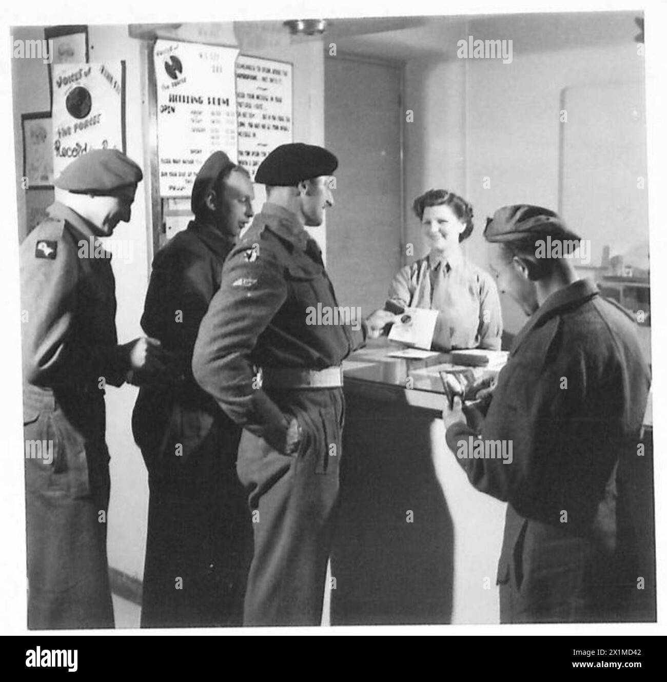 ITALY : 'VOICES OF THE FORCES' - Ted Jellyman buys the first record in the 'Voices of the Forces' scheme, from the NAAFI shop in the Alexander Club in Rome, British Army Stock Photo