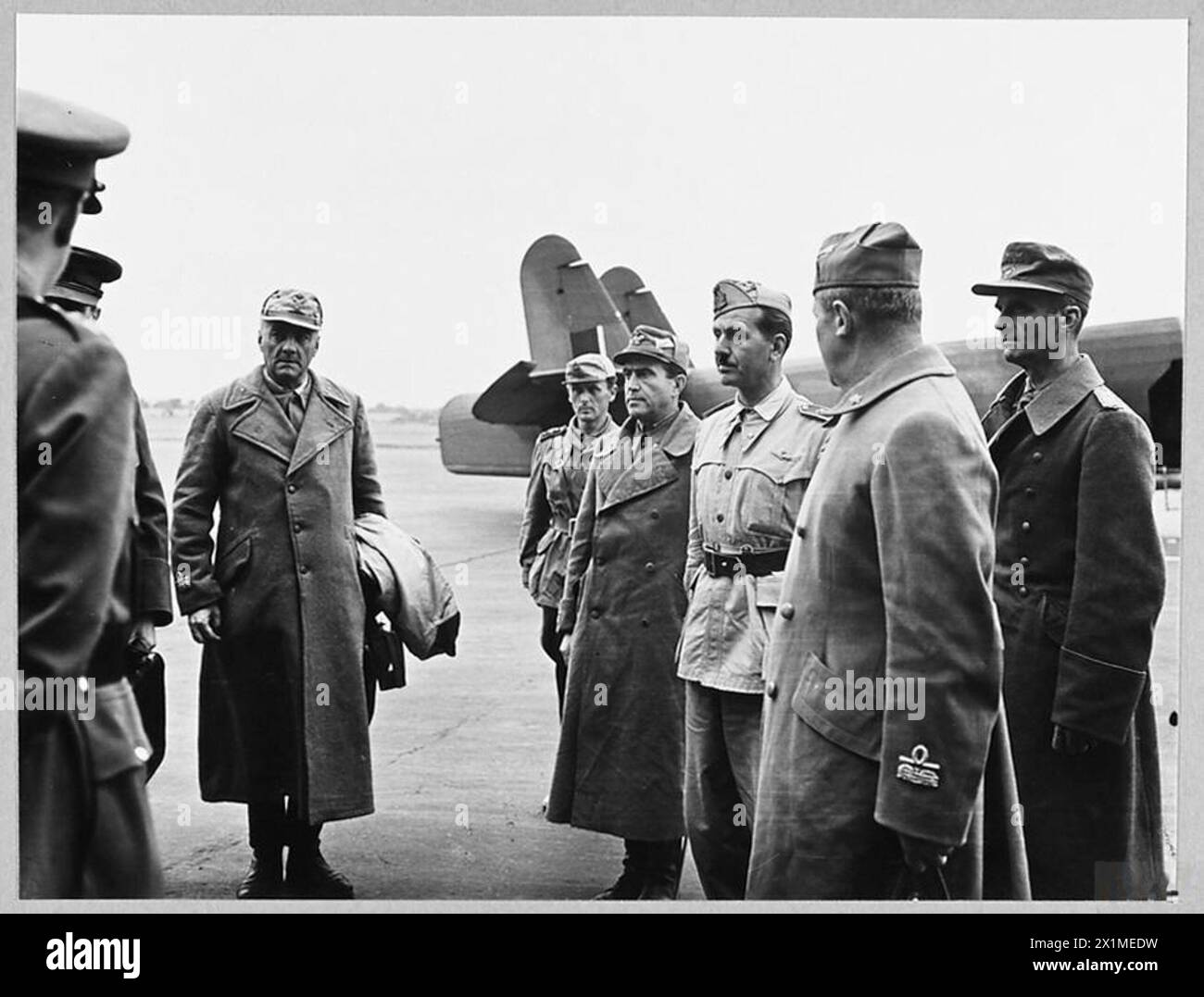 AXIS GENERALS ARRIVE IN SOUTH OF ENGLAND AS PRISONERS OF WAR. - 9958. Picture (issued 1943) shows - left to right - General Costa; Captain Colombo; Brigadier General Mancinelli; Brigadier General Boschi; Brigadier General Aporti and Colonel von Hulsen, awaiting instructions from the receiving officers, Royal Air Force Stock Photo